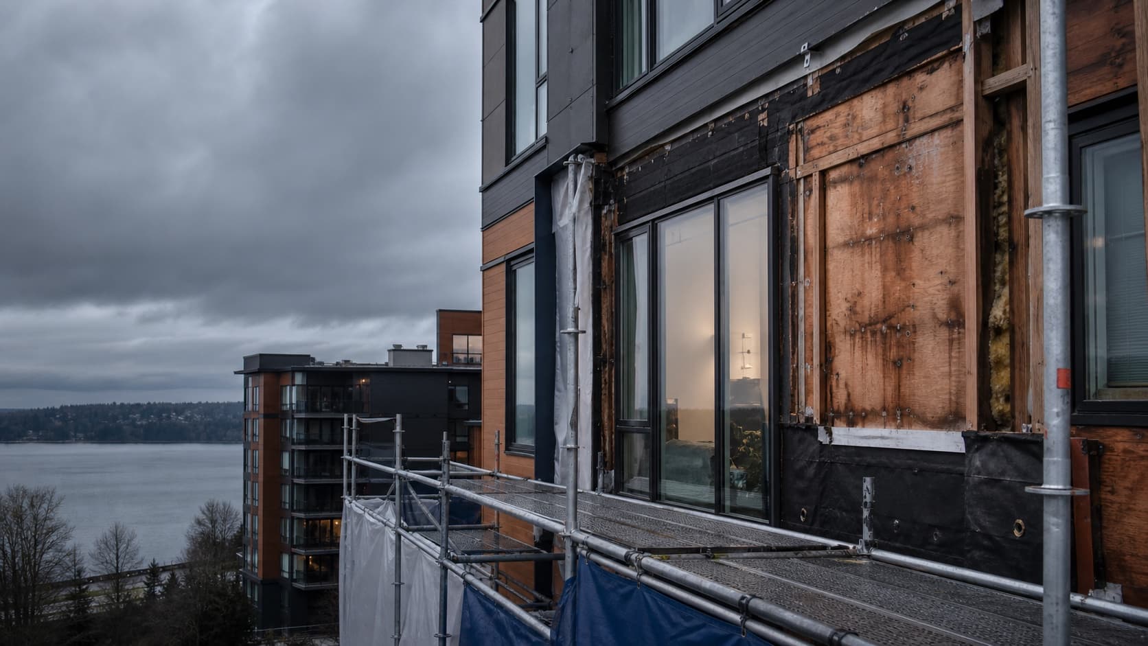 Multifamily building envelope opened for inspection and repair.